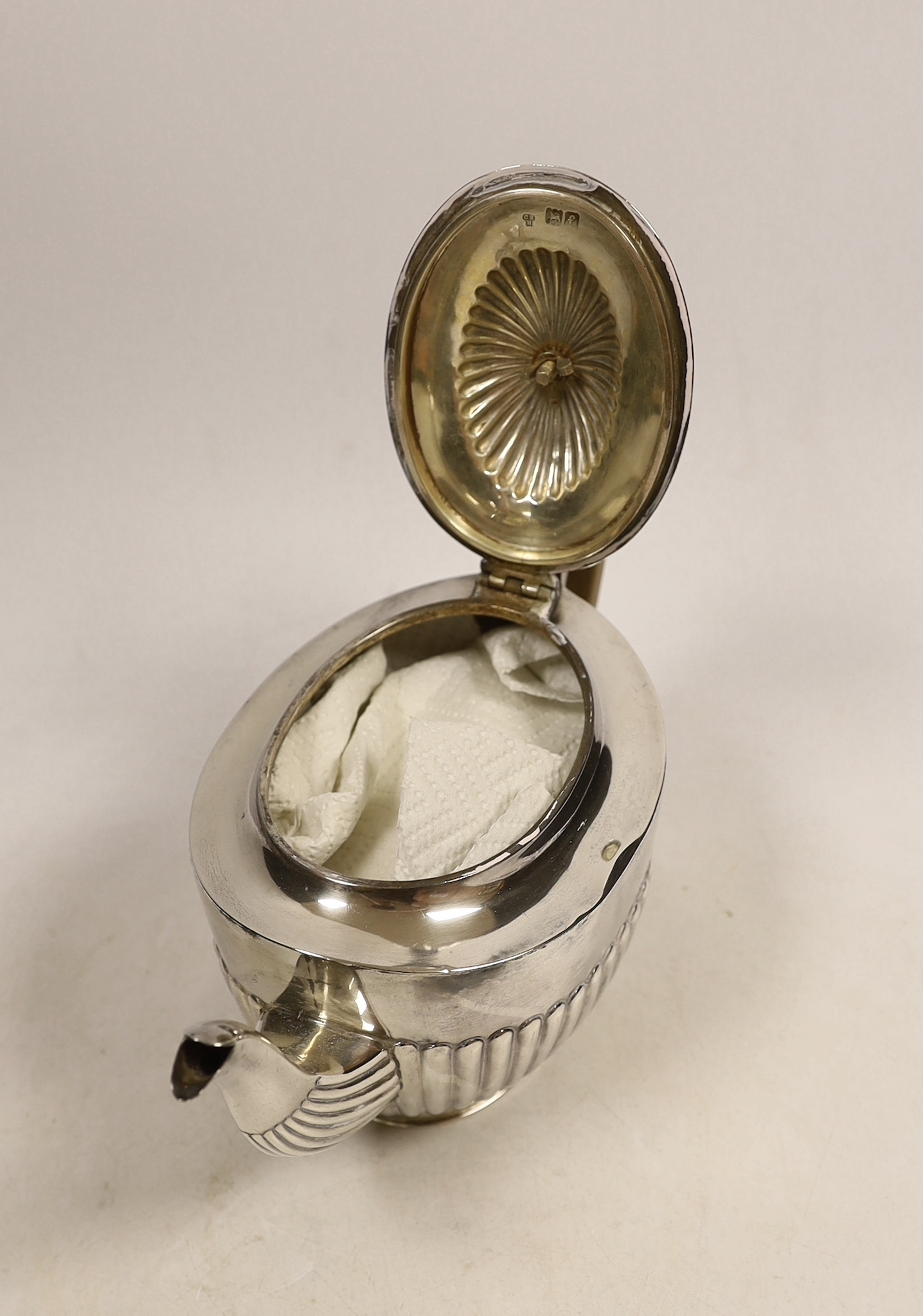An Edwardian demi-fluted silver oval teapot, by Charles Stuart Harris, London, 1901, gross 16.5oz. CITES Submission reference WCCS1GJL